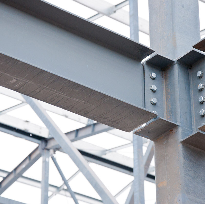 Metal frame of the new building against the sky